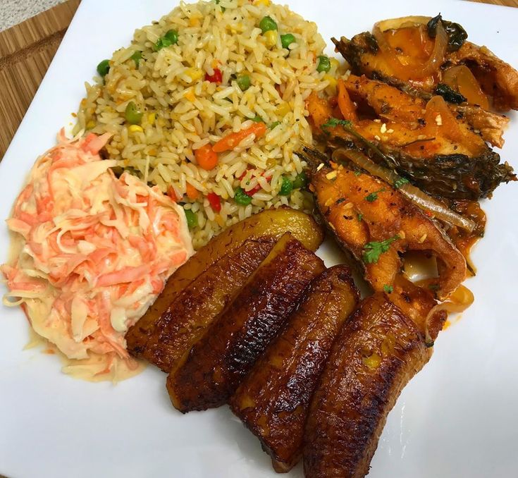 Fried Rice, salad, plantain, and Titus Fish